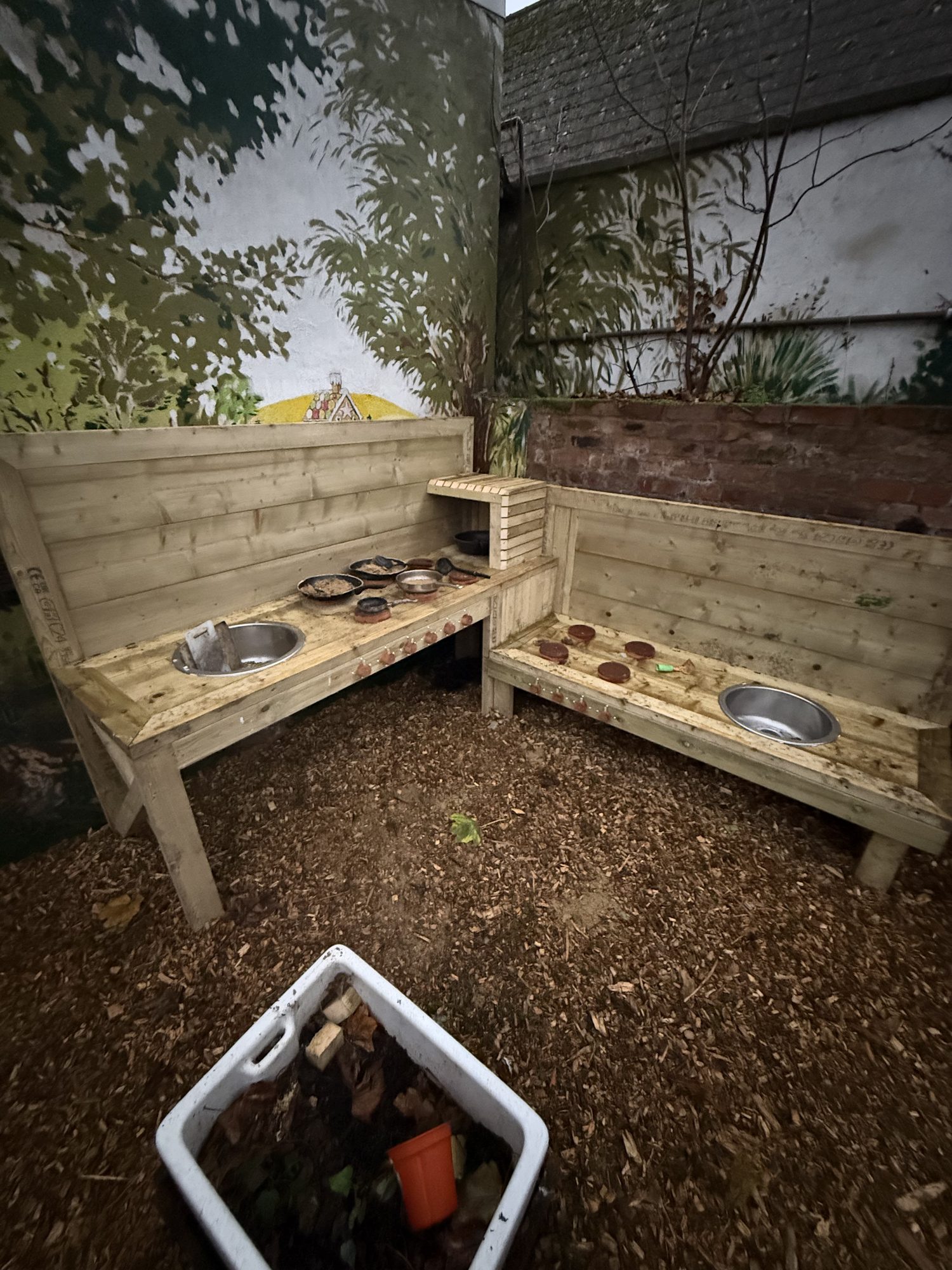 Close view of the handmade timber mud kitchen in the play garden