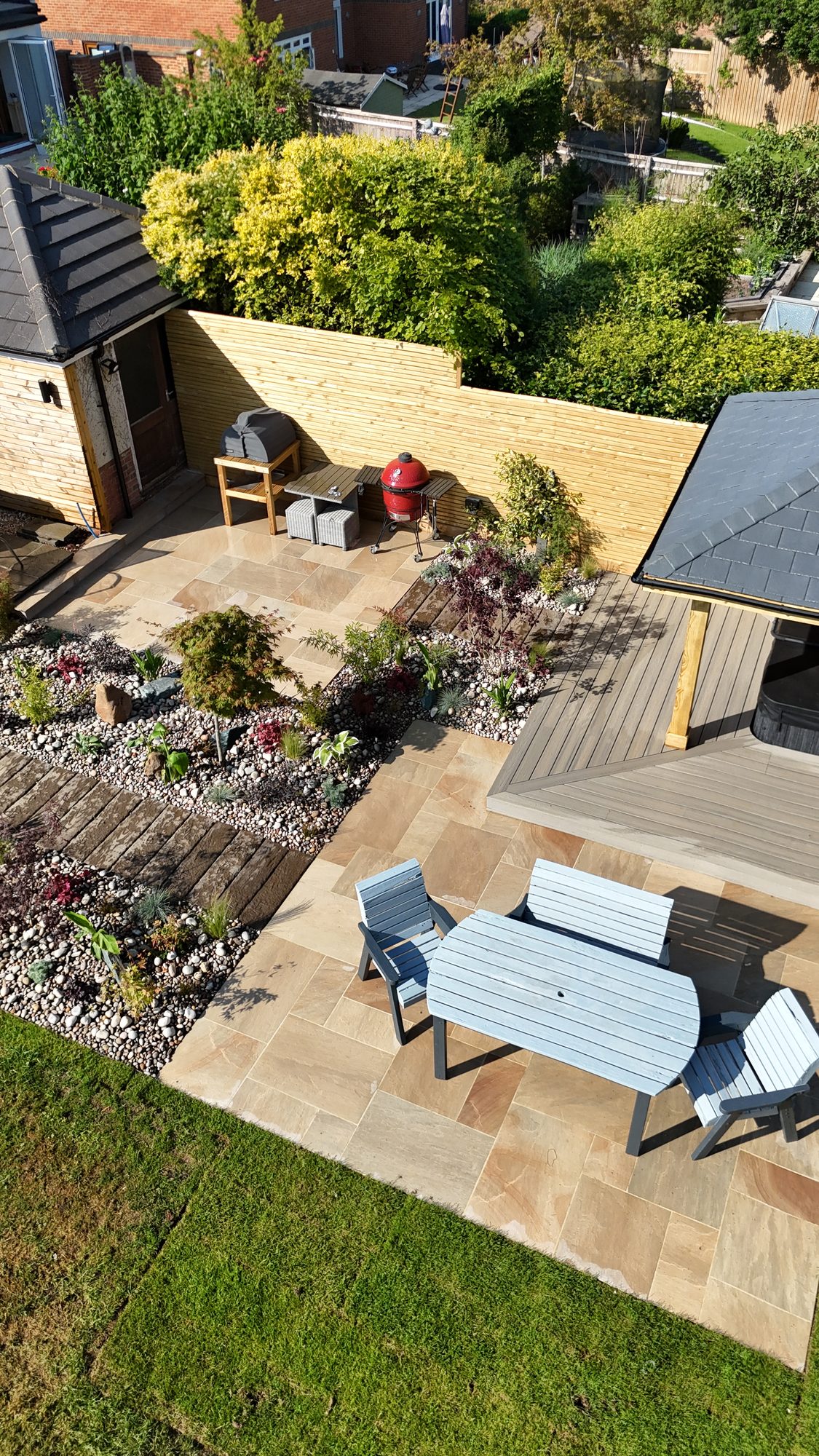 Overhead view of a garden layout with garden room, sandstone patio and planting borders